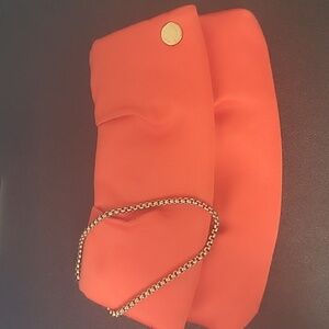 EUC Henri Bendel Orange/peach Evening Wristlet Exterior satin like material